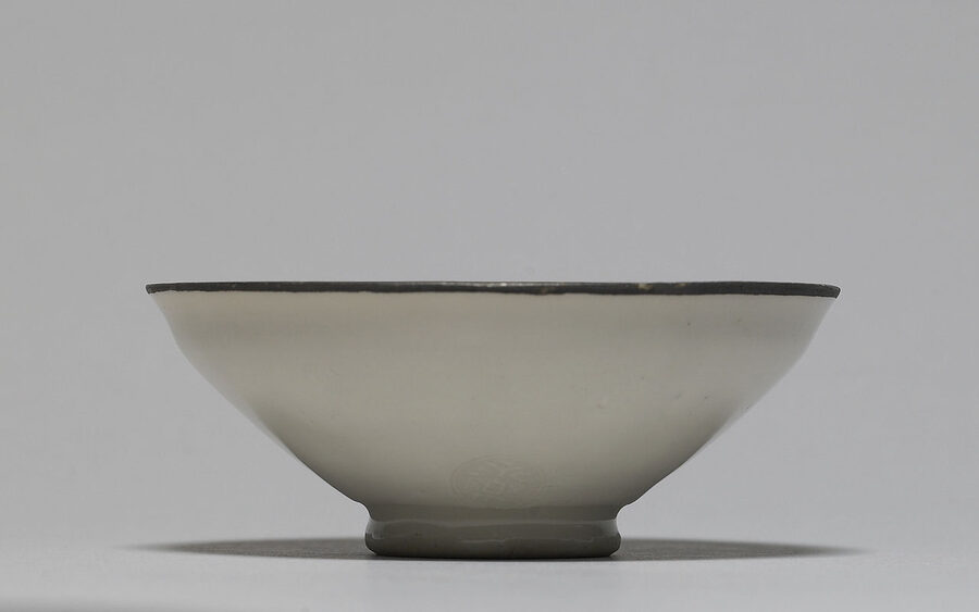 An Eiraku Tokuzen ochoko sake cup with phoenix design, traditional ceramic for warmed sake