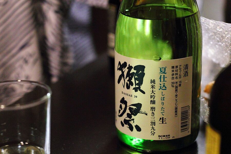 A line-up of Dassai brand sake bottles in different polish-rate variants