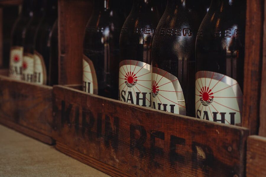 A wooden crate of vintage Japanese beer bottles ready for delivery