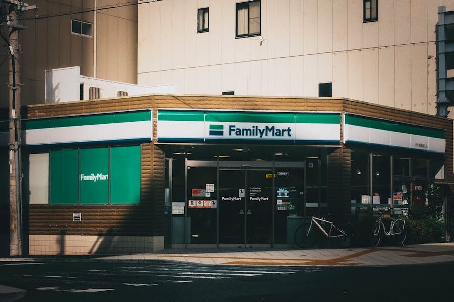 A FamilyMart convenience store exterior in Japan with bicycles parked outside