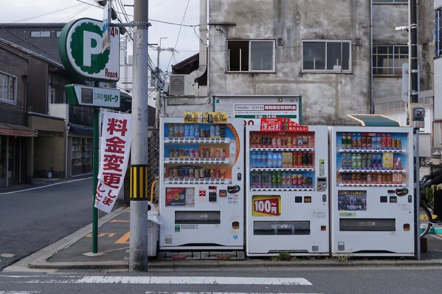 A pair of Japanese vending machines on a quiet Tokyo street