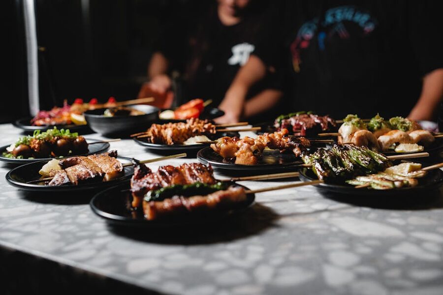 A platter of yakitori chicken skewers ready to serve in a Tokyo izakaya