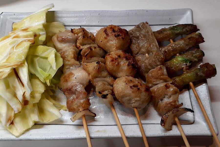 Yakitori skewers being grilled at Matabee counter, Fukuoka