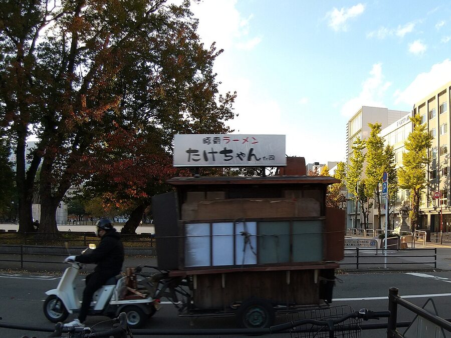 Yatai cart on its rearcar moving along Reisen Dori in Hakata