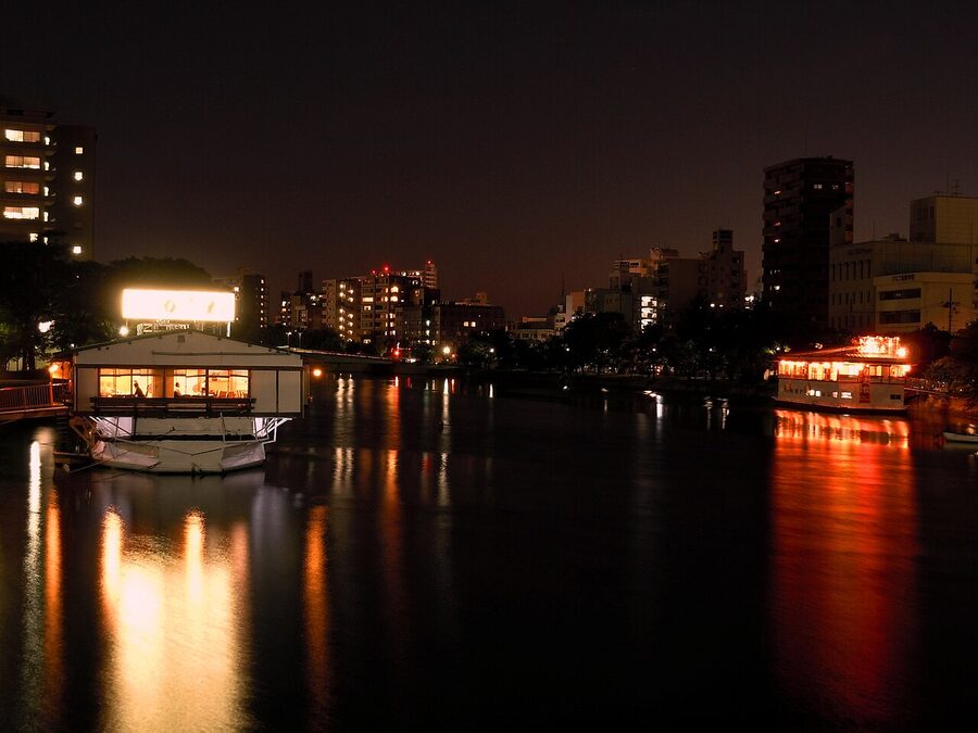 Oyster rafts ikada floating in Hiroshima Bay near the shoreline of Miyajima Island