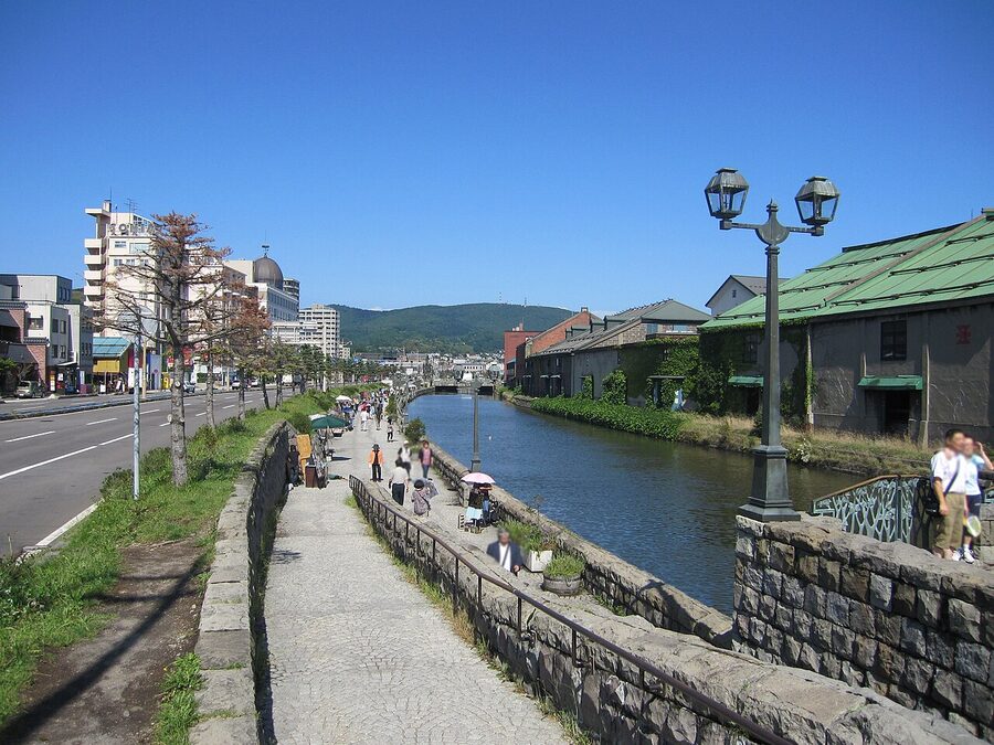 Otaru canal at dusk in summer with brick warehouses and reflection on water