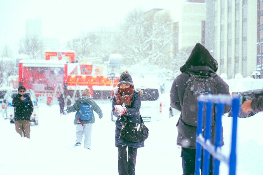 People walking on a snowy Sapporo street in winter