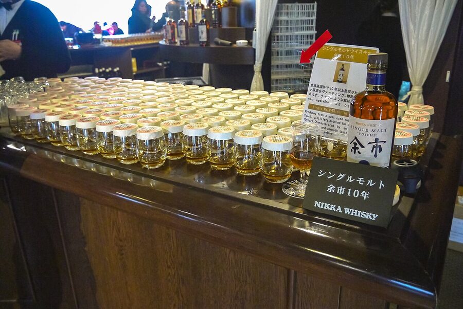 A glass of Yoichi whisky being poured at the distillery tasting hall