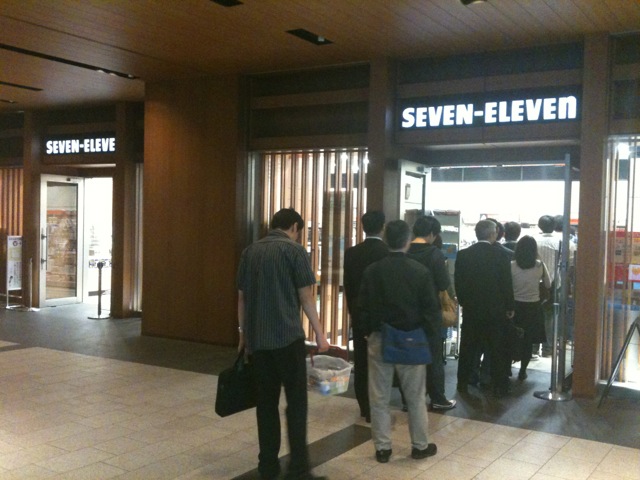 Customers queueing at a 7-Eleven in Japan