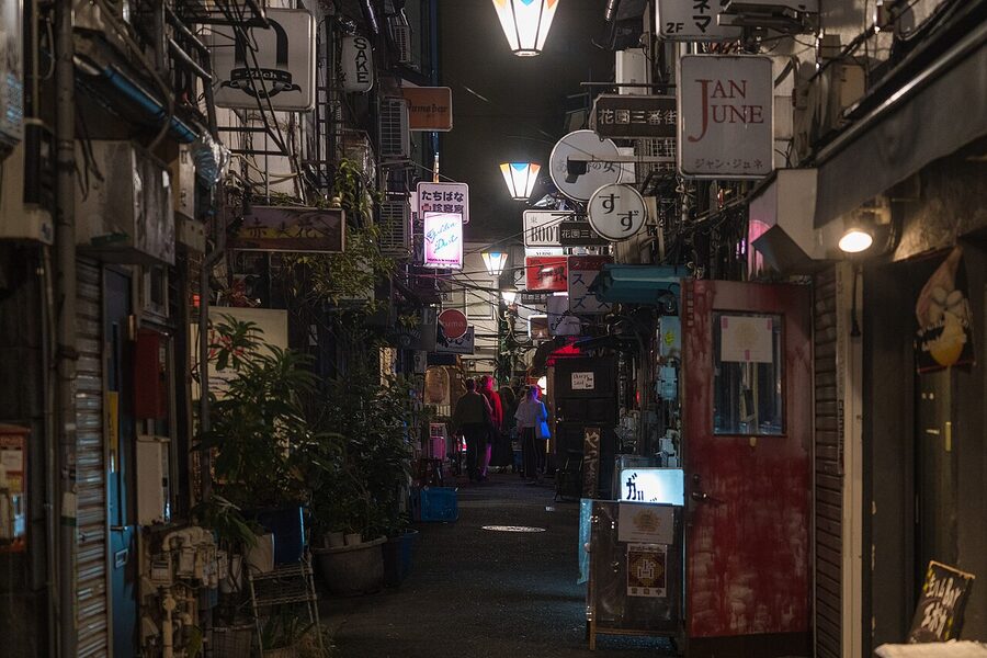 Shinjuku Golden Gai at night with neon-lit narrow alley