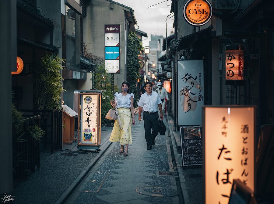Pontocho alley in Kyoto with traditional wooden buildings and red lanterns