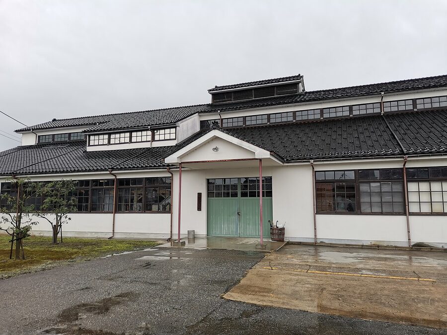 Saburomaru Distillery Toyama wooden building exterior with white walls