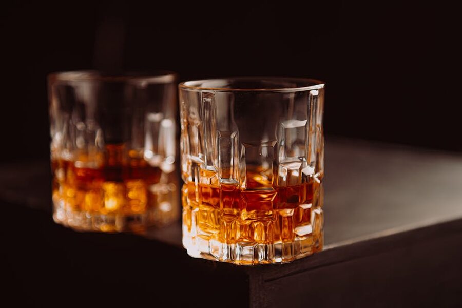 Whisky in tasting glasses on a dark surface