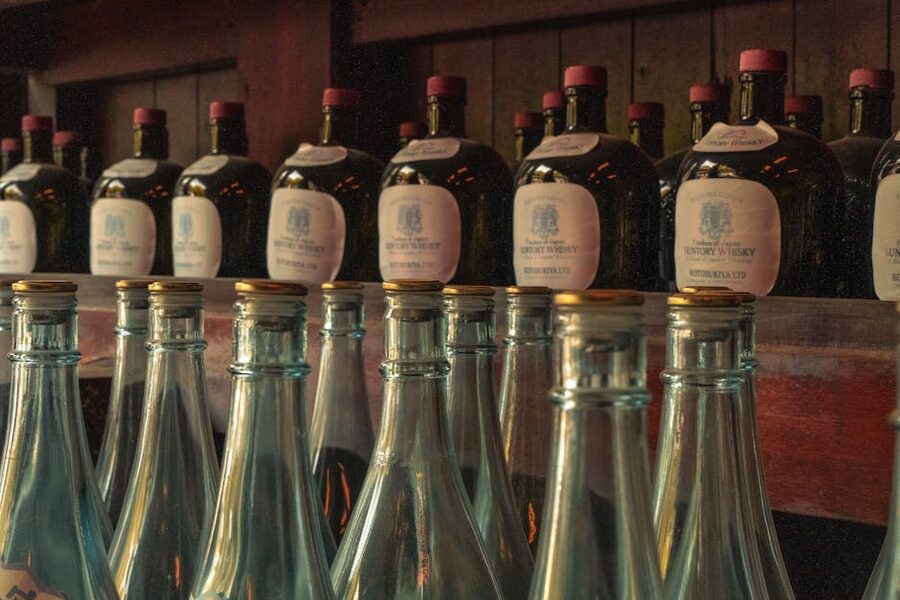 Rows of vintage whisky bottles in a Tokyo bar
