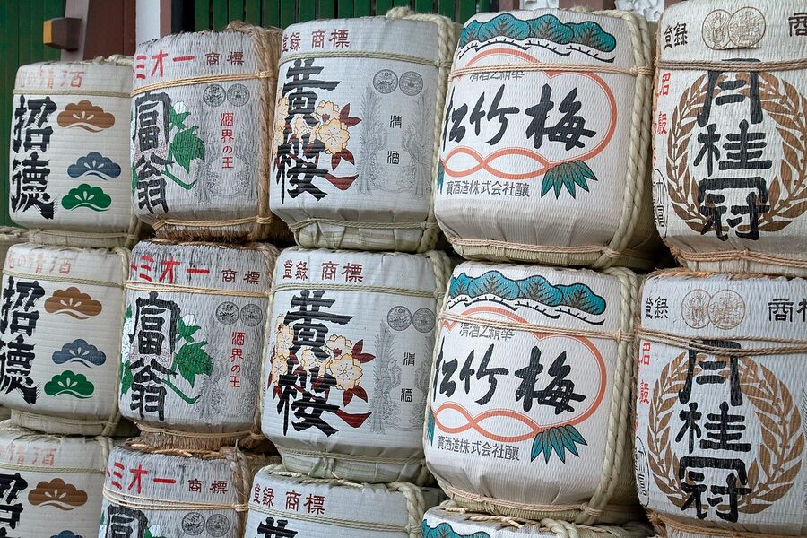 Sake offerings stacked at a Kyoto shrine in the Fushimi district