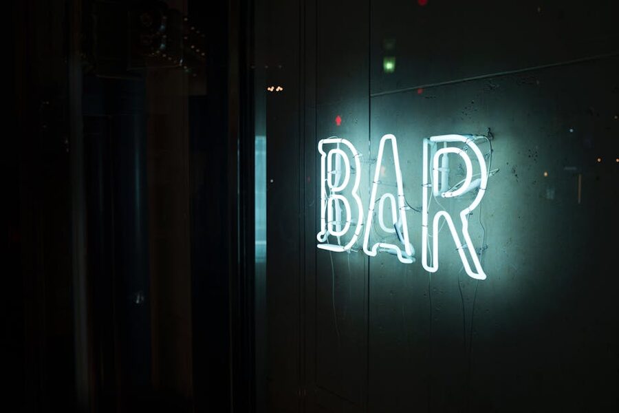 Neon BAR sign on a quiet Tokyo street at night