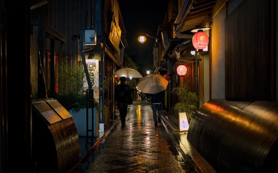 Pontocho alley on a rainy night with reflections in the wet pavement