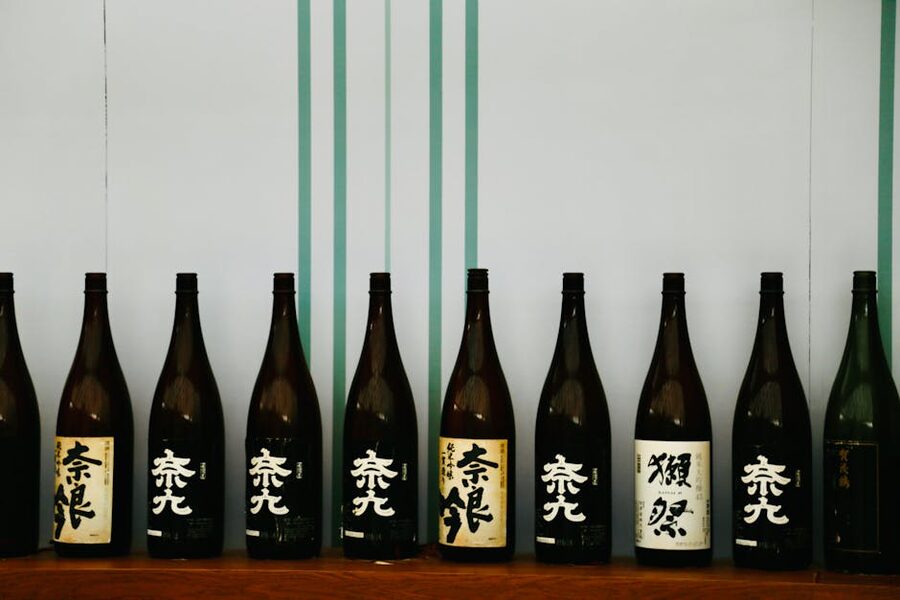 Sake tasting set with multiple small cups arranged in a row