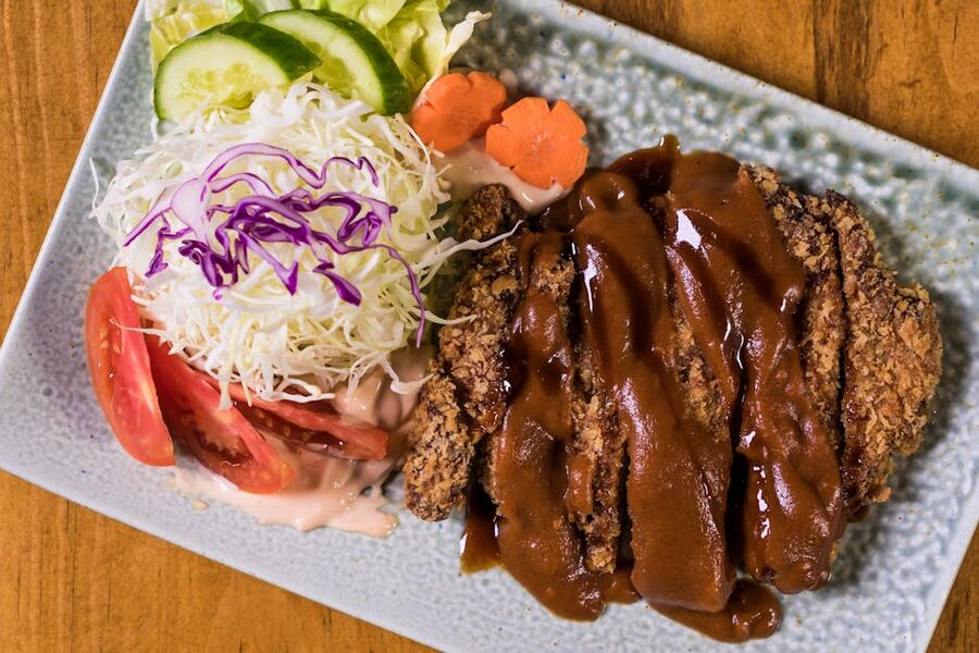 Crispy panko-breaded tonkatsu pork cutlet served with shredded cabbage