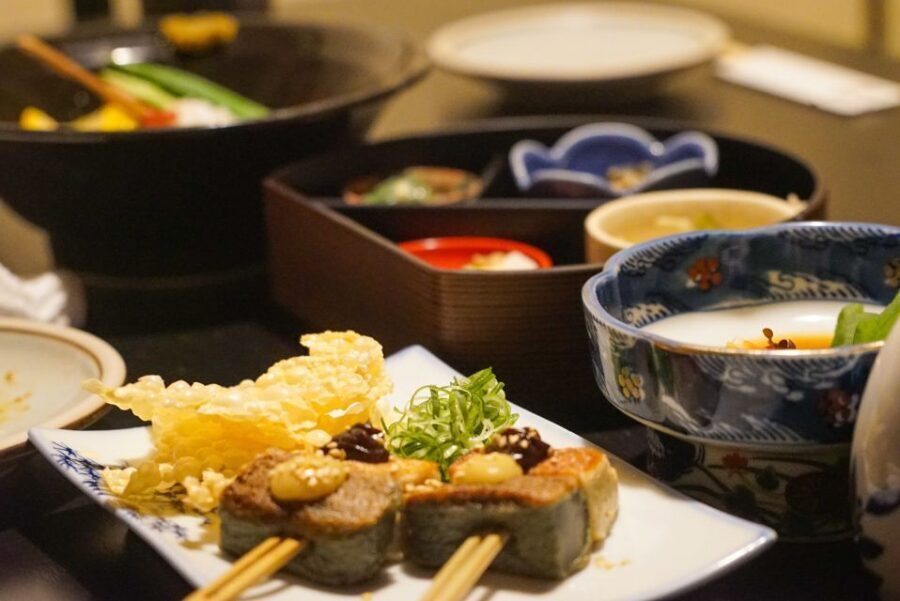 Kyoto: Foodie Night Tour in Gion with 9 dishes + 6 Sake - Walking Through Pontocho: Where the Night Feels Like Food