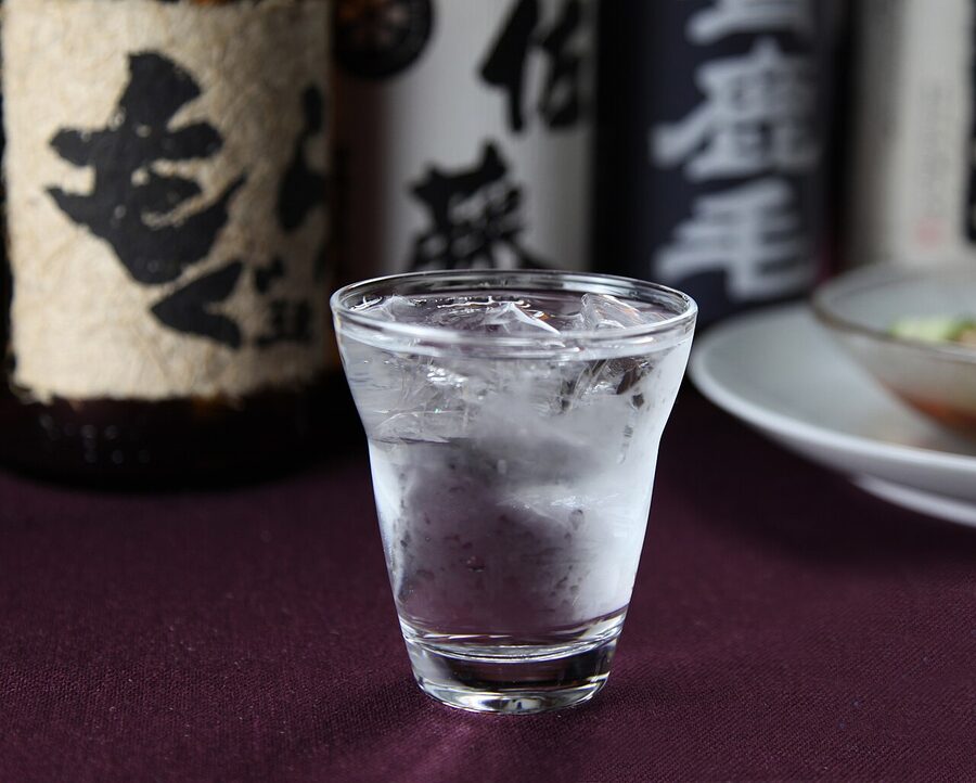 Bottles of Japanese shochu lined up at a Kyushu distillery shop