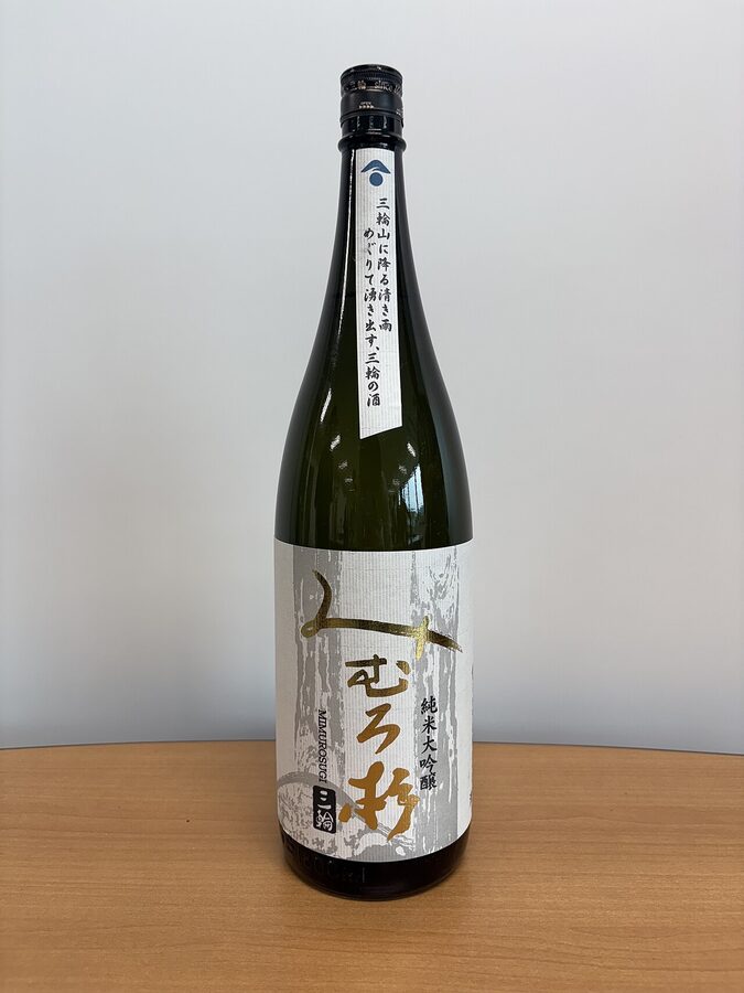 A bottle of Mimuro Sugi Junmai Daiginjo with a pale label and Japanese calligraphy