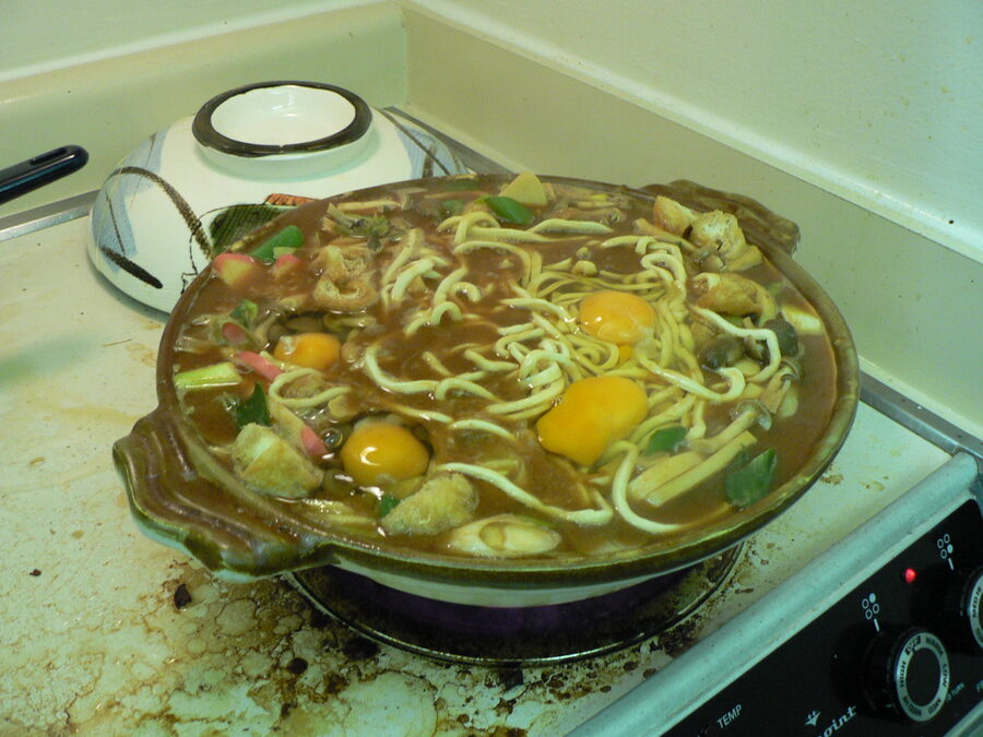 Miso nikomi udon simmering in a clay pot in Nagoya