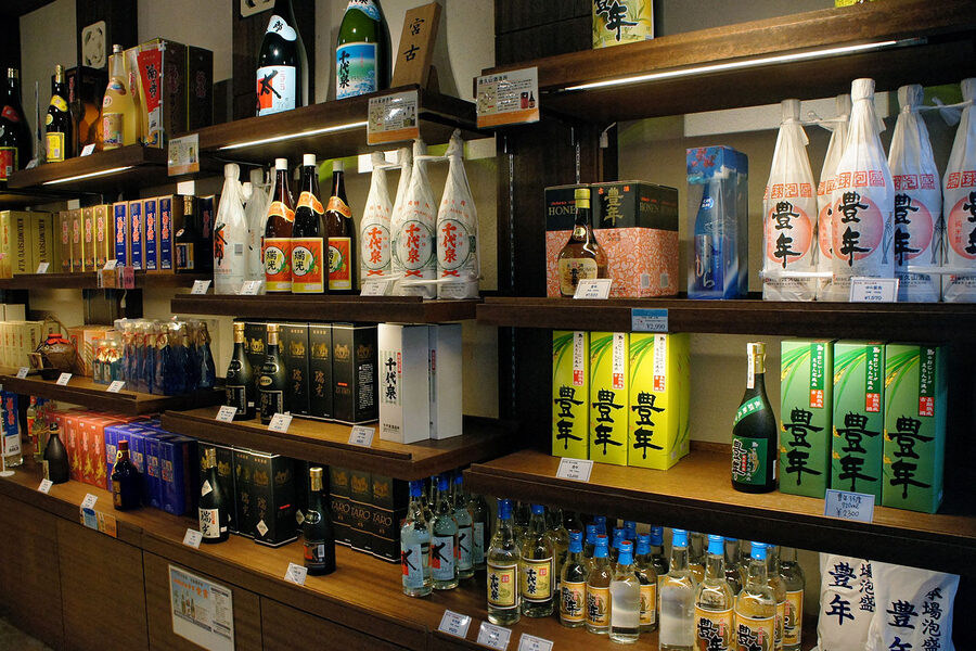 Awamori bottles on bar shelf in Okinawa