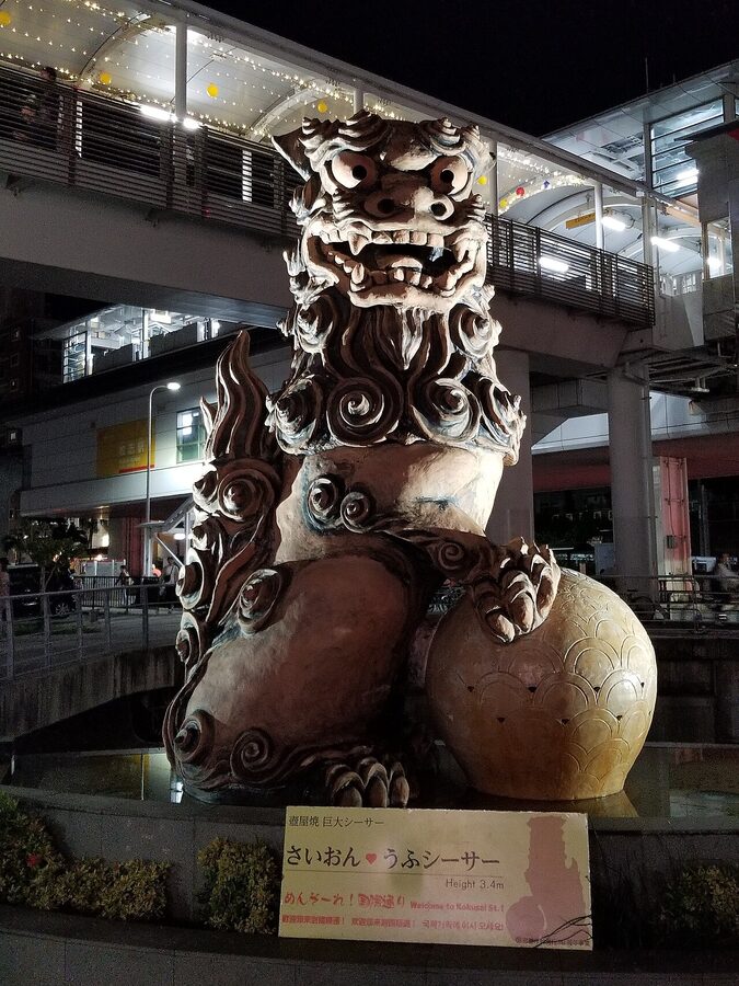 Saion Ufu Shisa lit at night Naha Okinawa