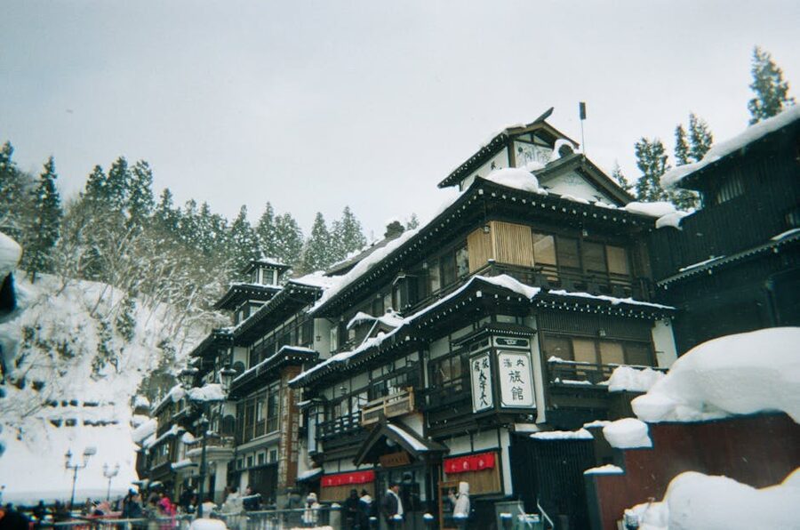 Snowy onsen town with traditional Japanese architecture