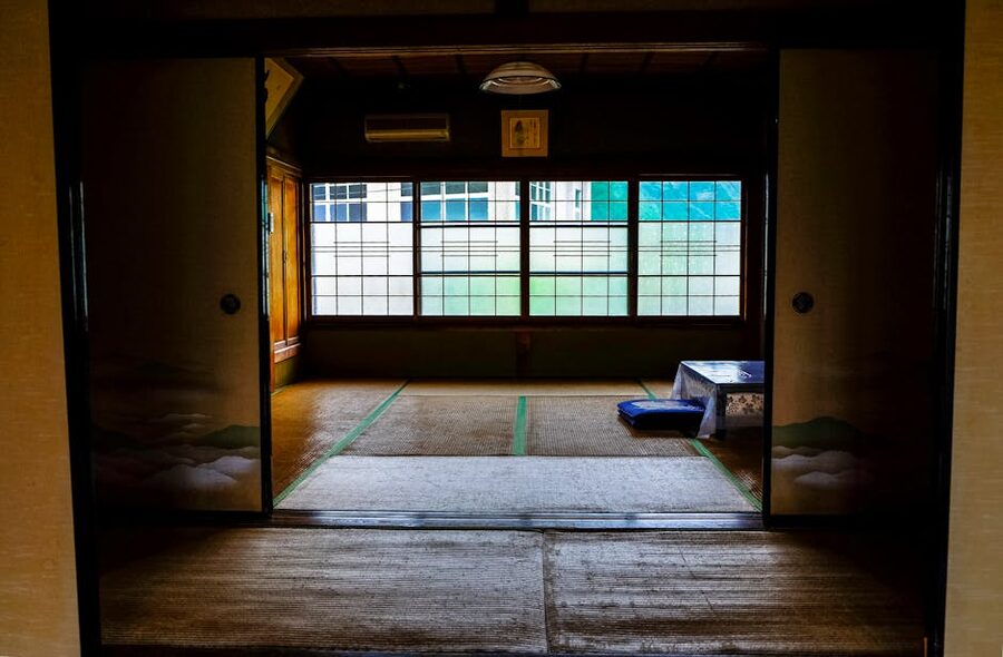 Serene interior of a traditional Japanese ryokan with tatami flooring
