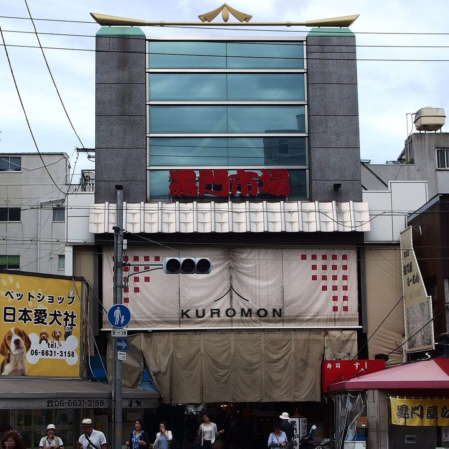Kuromon Ichiba market arcade in Osaka with shoppers and food stalls