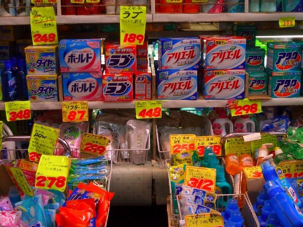 Cooked-to-order seafood stalls inside Kuromon Ichiba market, Osaka