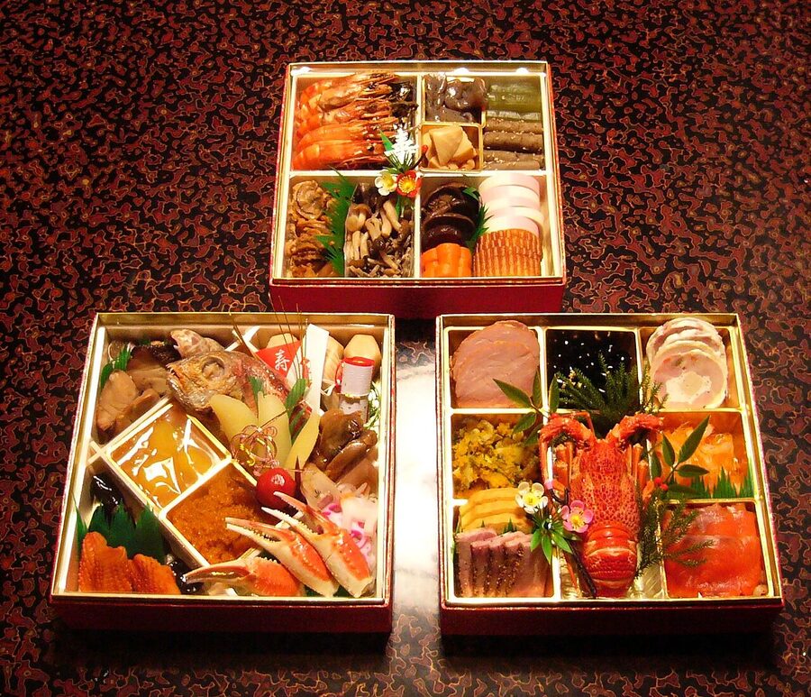 A traditional Japanese osechi jubako stacked lacquer box with New Year's foods