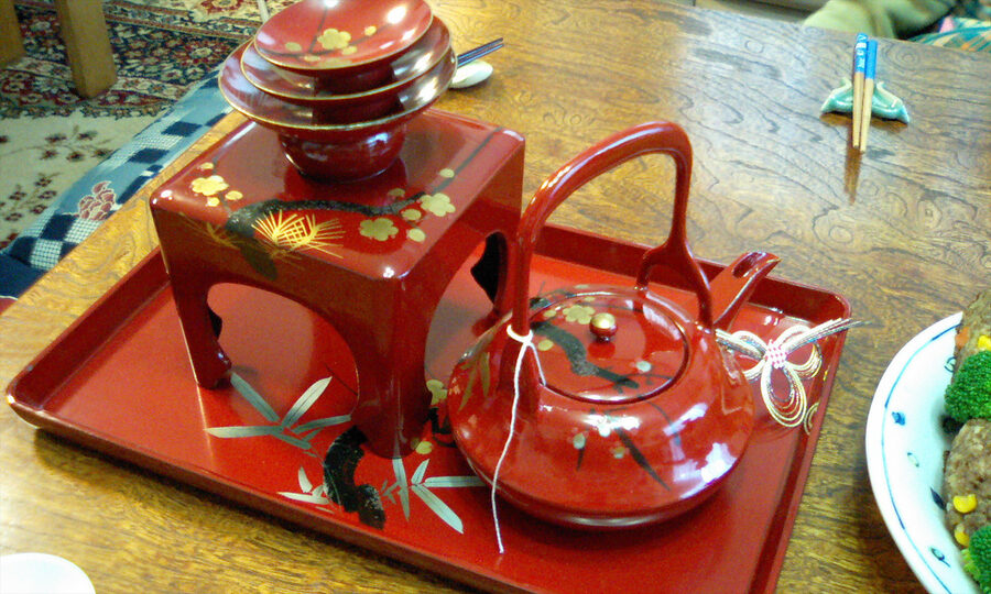 Otoso poured from the choshi vessel into a small lacquer cup at New Year