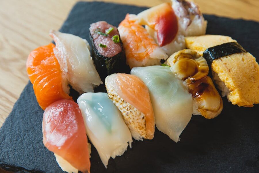 An assortment of nigiri sushi with raw fish toppings, the classic high-end daiginjo pairing