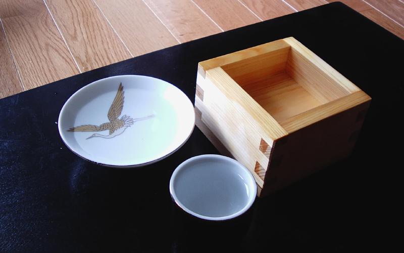 Traditional Japanese sake set with tokkuri carafe and ochoko cups