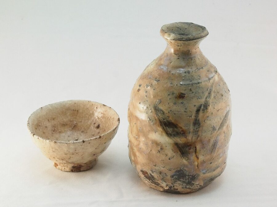 A traditional Japanese pottery sake bottle and cup set