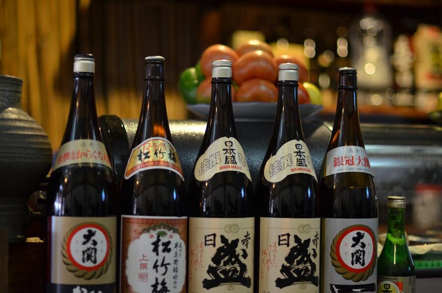Array of traditional Japanese sake bottles displayed at a Tokyo retailer
