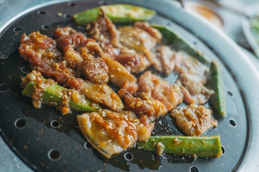 Grilled lamb meat and vegetables on a Genghis Khan grill