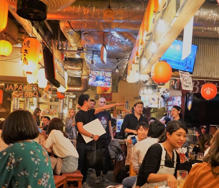 Shibuya Meltdown Night Tour: All-You-Can-Drink Bar Hopping - Stop 1: a full dinner start, plus two starter drinks
