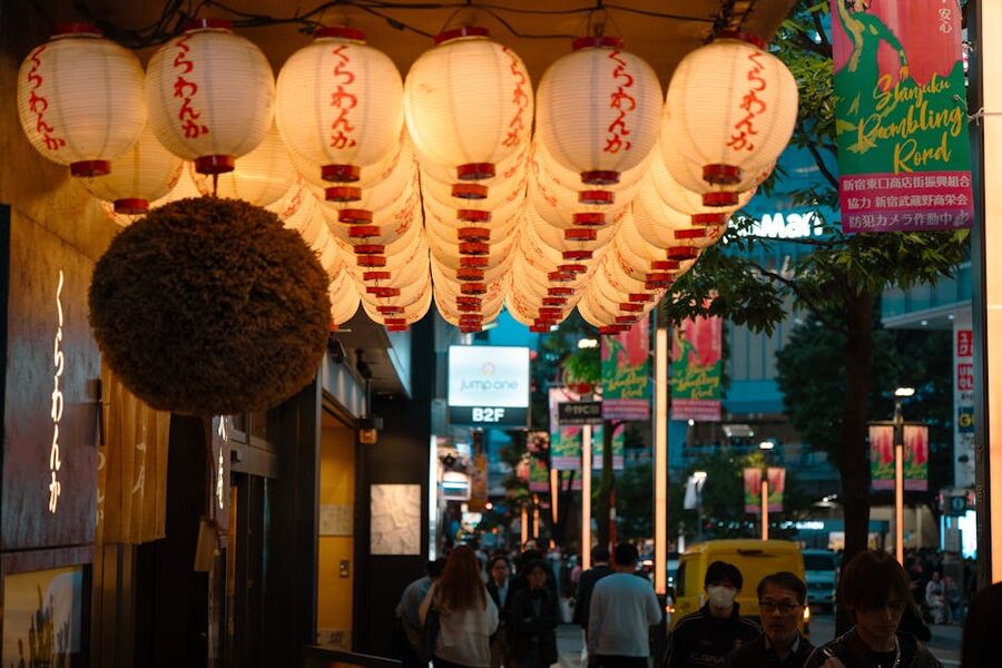 Tokyo street lined with paper lanterns at night