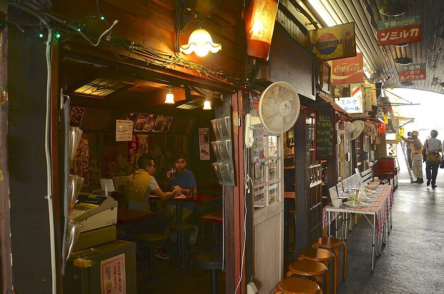A glass of beer on a counter at a Yurakucho gado-shita standing bar