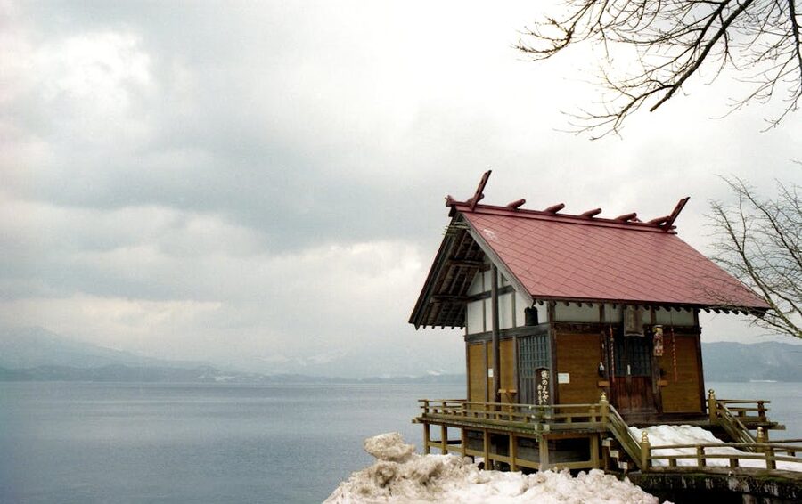 Akita shrine in winter near a lake