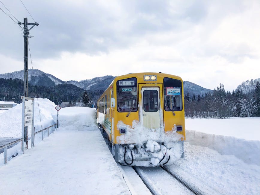 Yellow JR train in Akita snow