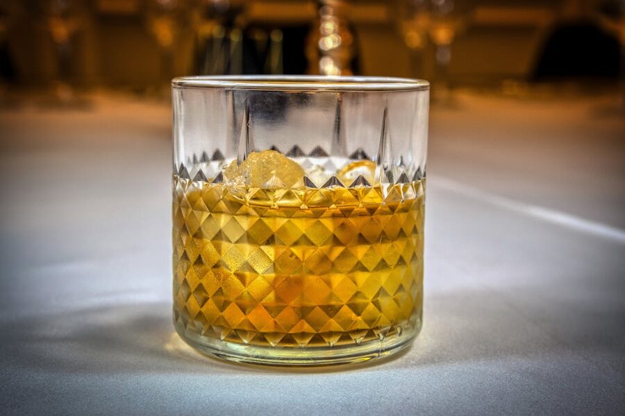 Whiskey in textured glass with low light