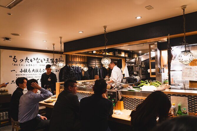 Tokyo Ginza Authentic Food Tour (Izakaya Hopping by local guide) - Stop 2: Ginza Mitsukoshi Crosswalk Photo Pause by the Seiko Clock Tower