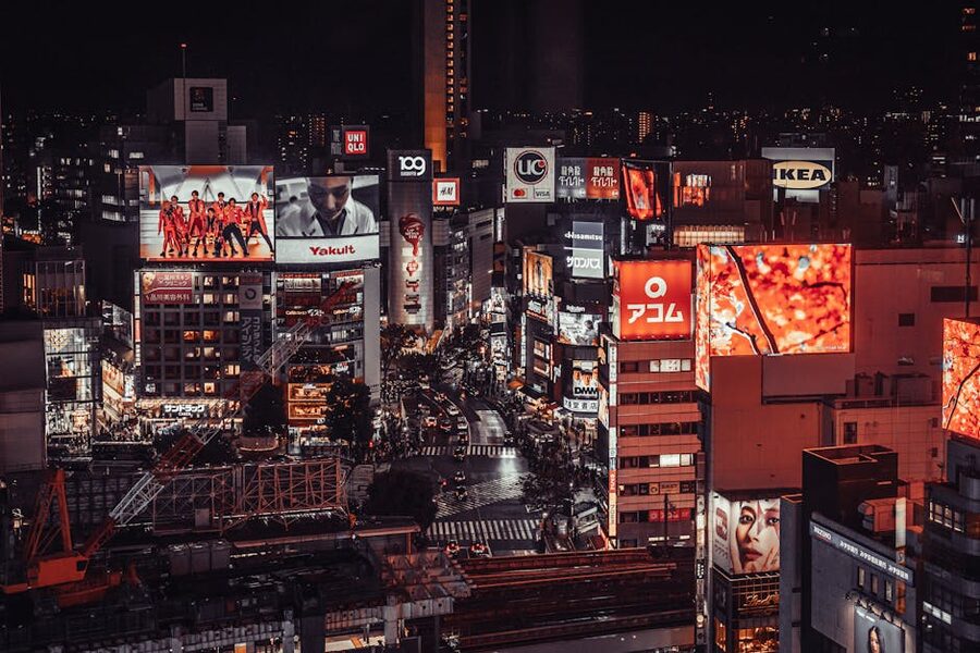 Shibuya at night with illuminated billboards