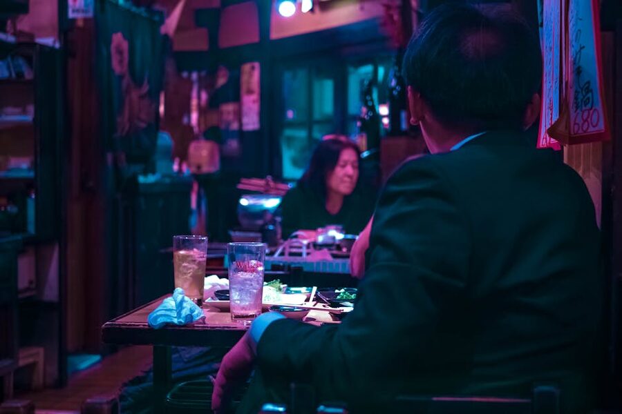 Salaryman seated at a Tokyo izakaya counter