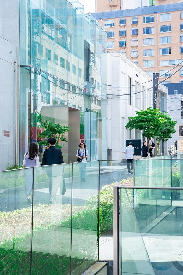 Aoyama Tokyo street with modern shopfronts and trees